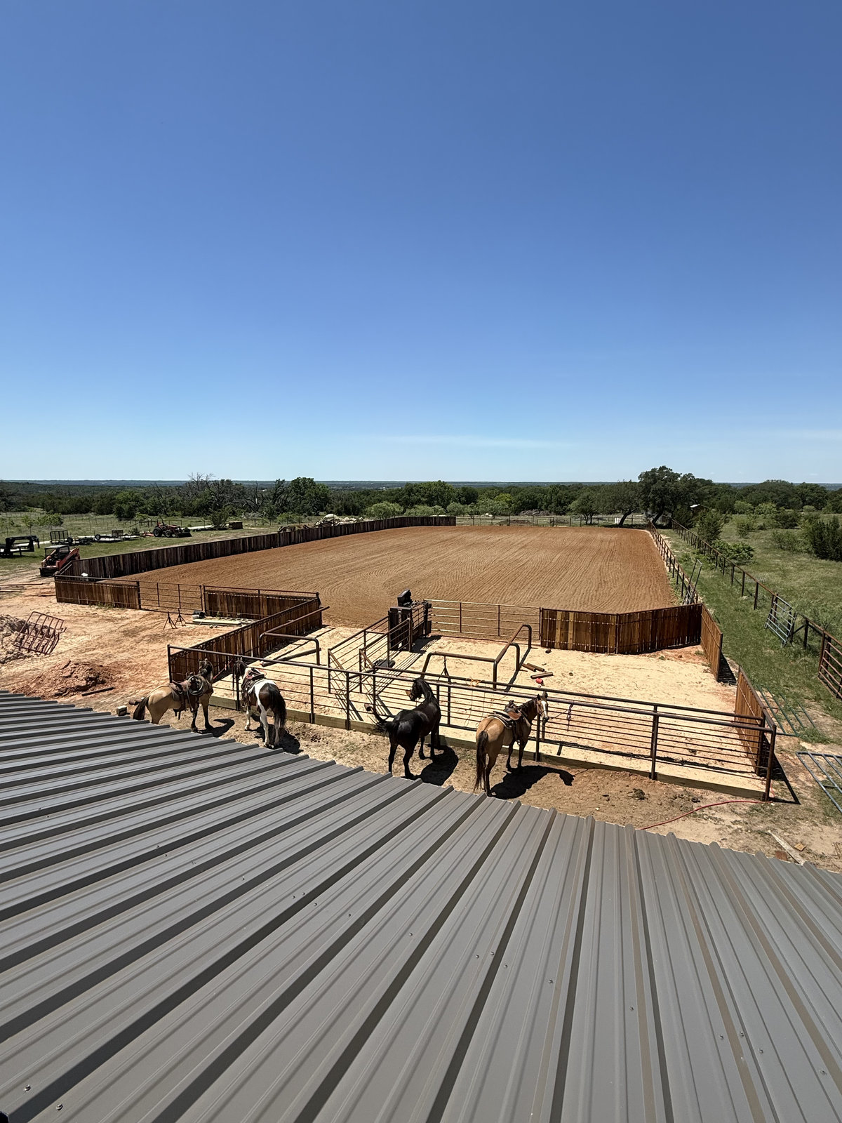 The same arena finished with fence, pens, and footing