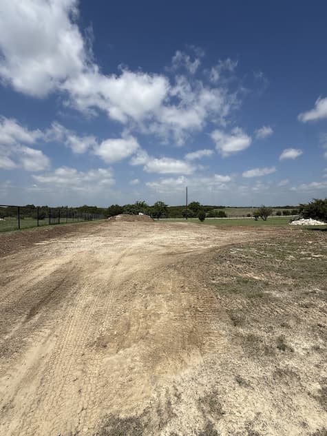 Land being cleared and graded for a riding arena