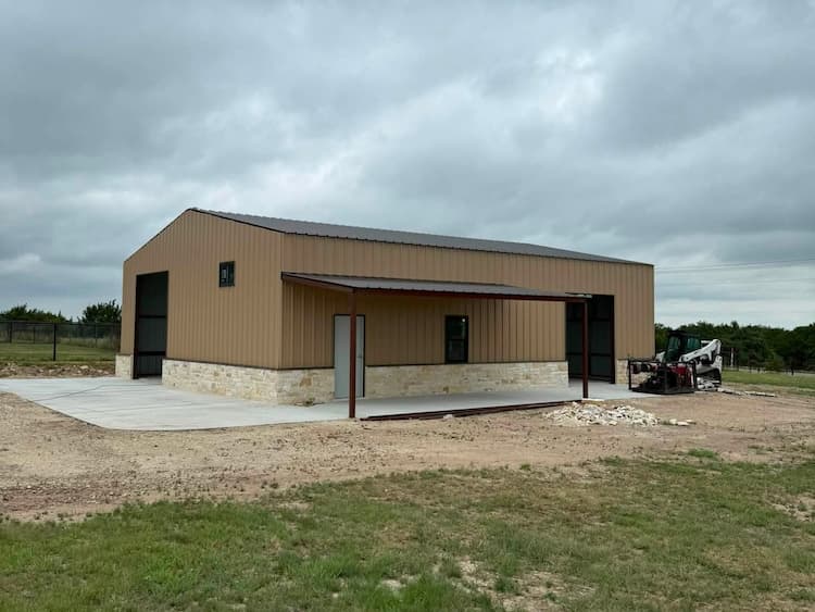 Steel frame of a metal building erected on a fresh concrete slab