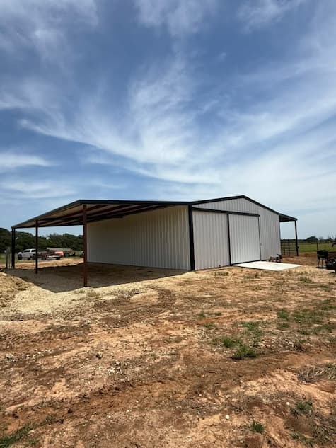 Finished metal building with stone wainscot and roll up doors