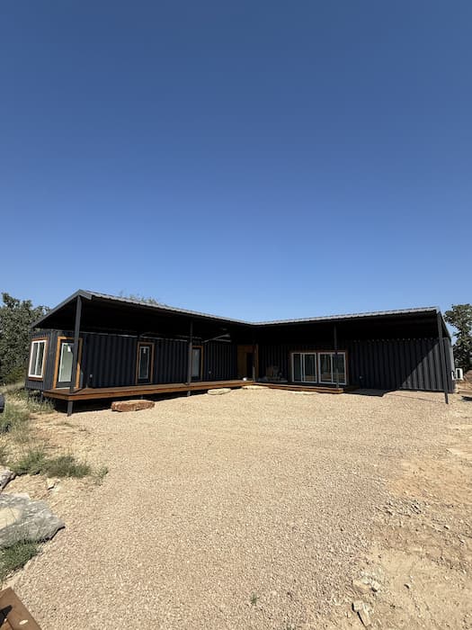 Finished two container retreat with stained deck and hill country view